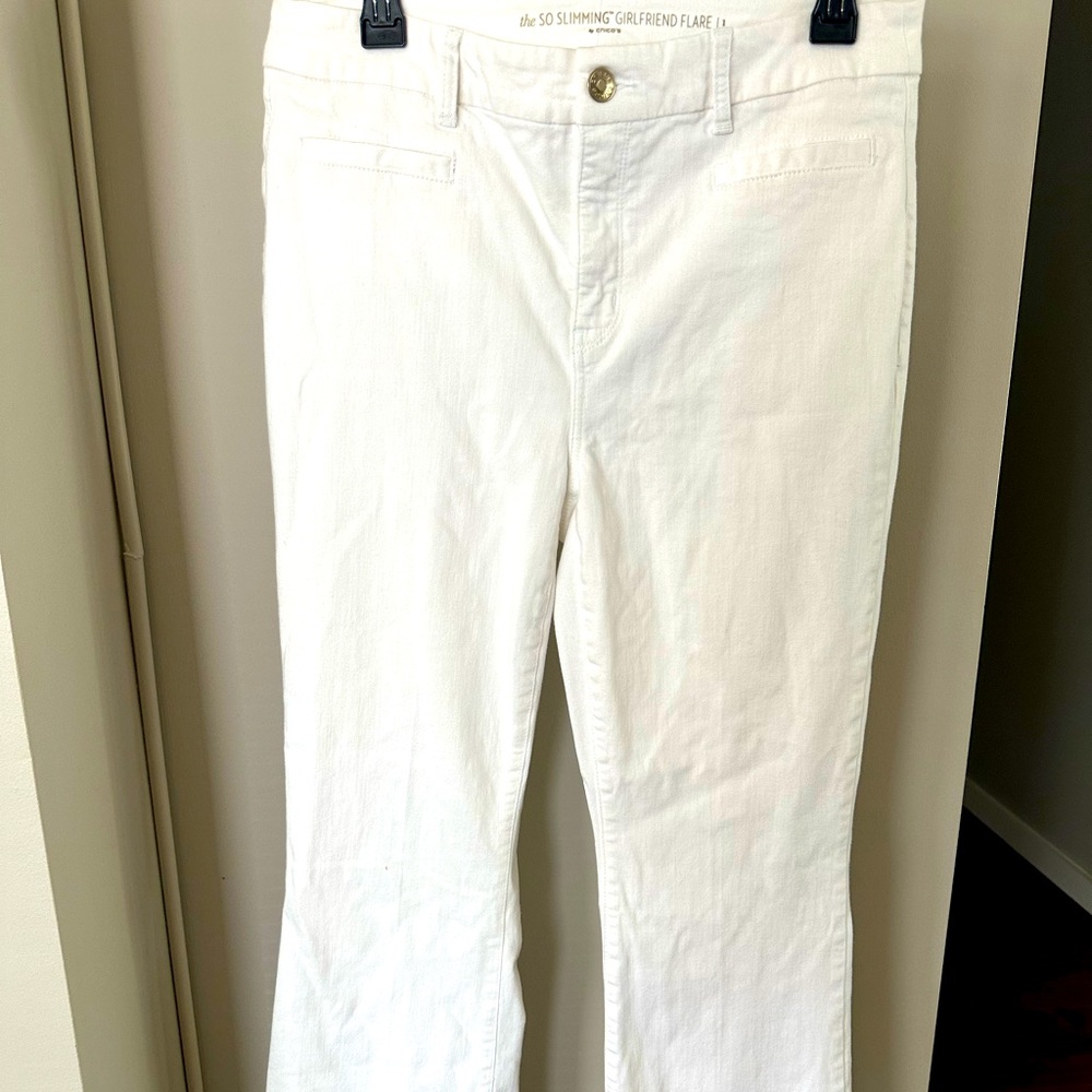 Chico size 1 white slimming pants with flare bottom. Excellent condition.